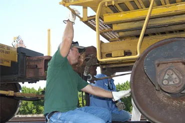 Railcars being visually inspected